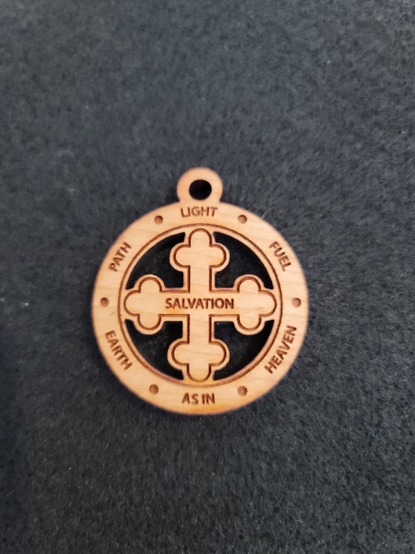 A wooden medallion with the name of salvation written on it.